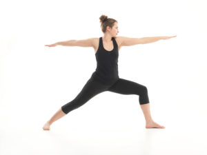 yoga pose variation, demonstrated by young female instructor