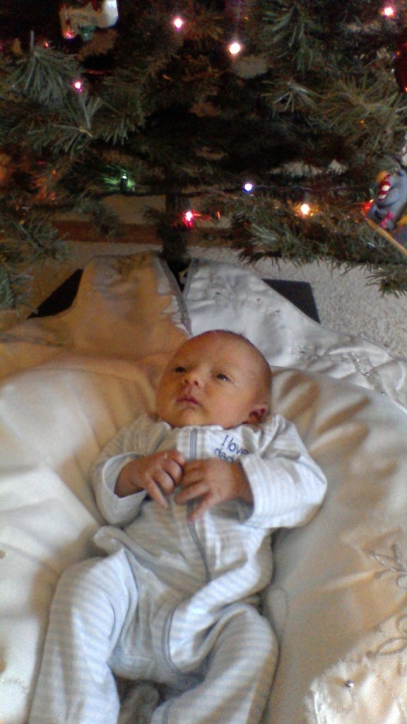 breech baby under Christmas Tree